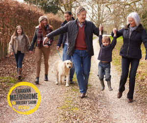 Loge owners walking dogs with family